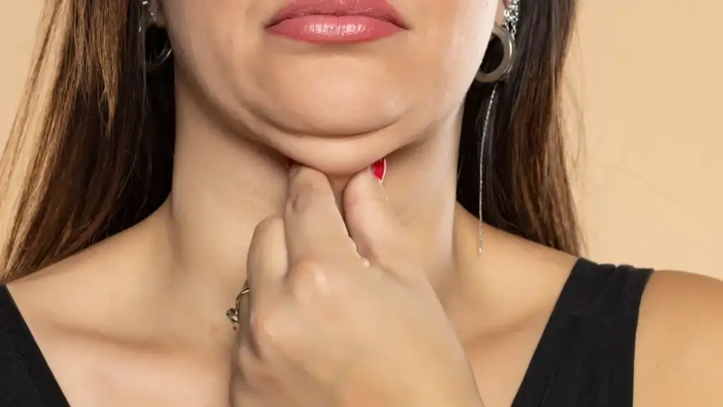 An image of a woman with double chin, sad, worried : Non Surgical Double Chin Removal Treatment in Glasgow, UK